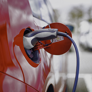 Red Electric Car during charging,  with copy space